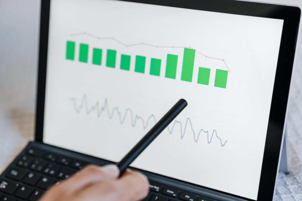 close up of unrecognizable Woman working on financial data with computer.Tech and business concept